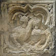 Panel 19:02 - Two basilisks biting each other's backs